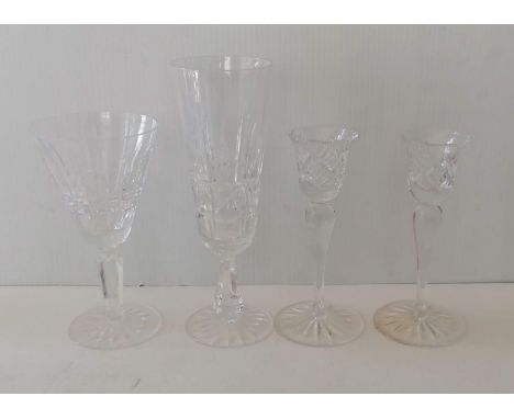 A set of eight Waterford Crystal wine or water glasses, 16 cm H and six champagne flutes, 20.5 cm H, both from the Glenmore r