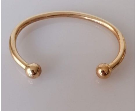 A 9ct yellow gold torc bangle, 65mm internal width, hallmarked, 30.88g