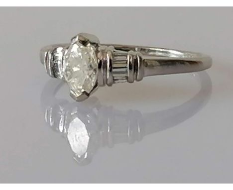 A marquise-cut diamond ring measuring 6.7 x 4.25 x 2.72mm, calculated weight 0.46 carats, colour/clarity K/L, I1, claw-set to