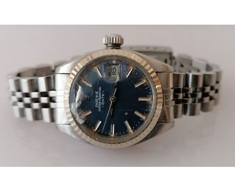 A ladies Rolex Oyster Perpetual Date wristwatch, ref. 6917, serial number 7087xxx, circa. 1981, fluted white gold bezel, blue