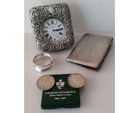 A Victorian silver-mounted travel clock with pierced and embossed trellis, scrolls and foliage by William Comyns &amp; Sons, 