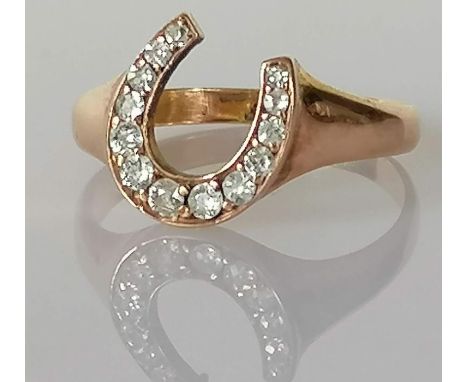 A Victorian diamond-set horse shoe ring, grain-set with thirteen old Swiss-cut diamonds, calculated diamond weight 0.34 carat
