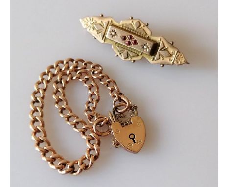 A late Victorian gold memorial brooch with seed pearl and garnet decoration, 4.5 cm, and a rose gold flat curb-link bracelet 