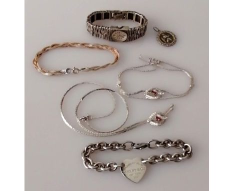 A sterling silver Tiffany &amp; Co heart bracelet; an Accurist bark-effect silver bracelet watch (not working); a matching ge