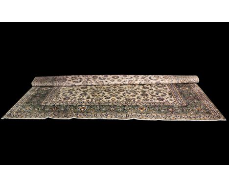 Large Traditional Carpet in Indian Style Agra with floral decoration on ivory ground, with small fringe trim. Measures 12' 8"