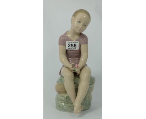 Nao large figure of young girl sat on stump, height 31cm