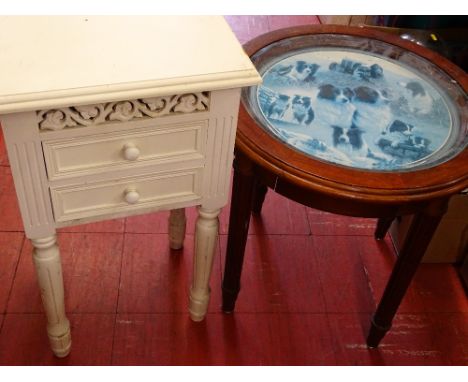 Circular occasional table on reeded supports with central picture of sheepdogs and tractor and a white French style two drawe