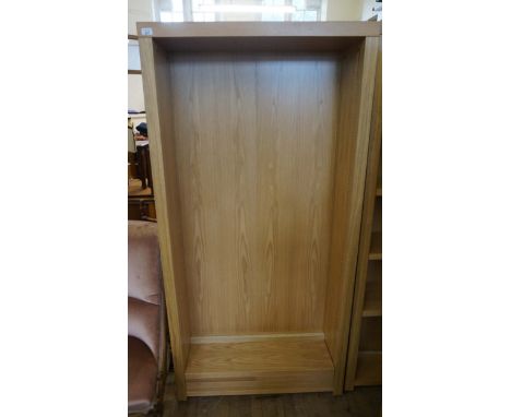 A modern light oak bookcase.