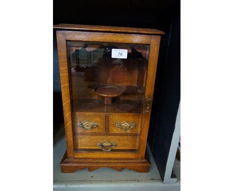 An early 20th Century light oak smokers cabinet.