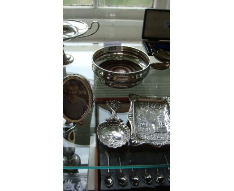 A Birmingham hallmarked silver rectangular plate entitled Punch, depicting Punch seated beside a dog, imported caddy spoon, B