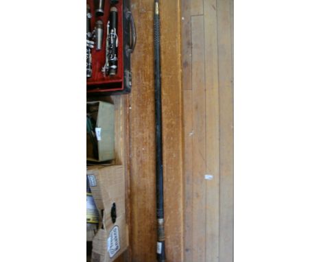 An early 20th Century white metal mounted with ebonised shaft swordstick.