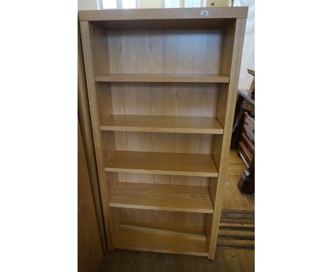 A modern light oak finished open fronted bookcase having four adjustable shelves.