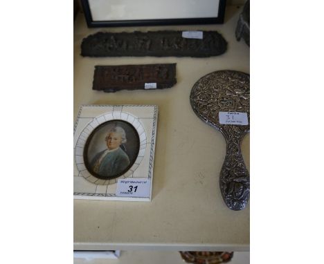 A hallmarked silver ladies dressing table mirror, relief decorated with roses, a hand painted portrait miniature in a Georgia