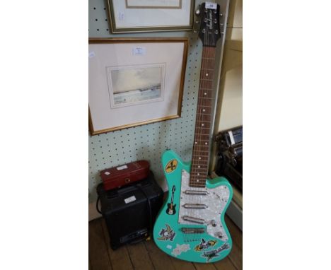 A modern Jackson electric guitar together with amplifier, etc.