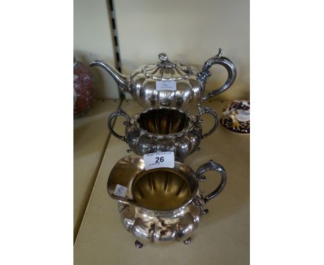 A James Dixon & Son silver-plated three piece tea service in the William IV style.
