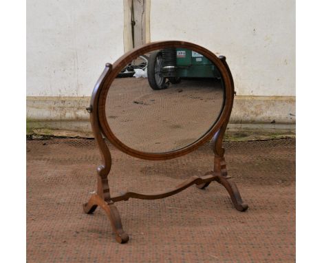 Late 19th Century walnut oval swing frame dressing mirror, 53cms high