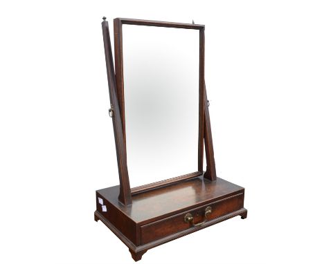 A mahogany toilet mirror, 19th Century, with rectangular bevelled plate, the plain uprights with urn finials, the base with t