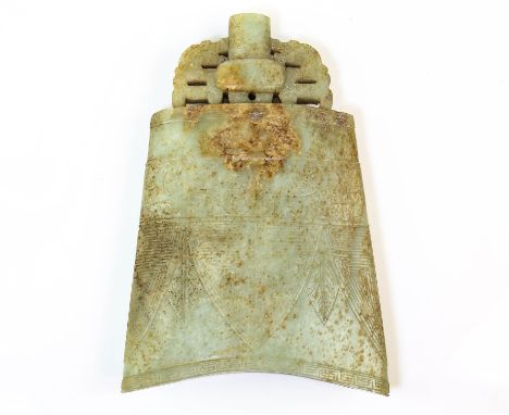 § A Chinese jade bell in the archaic style;  21 cm high, the base 13.5 cm wide. With mottled brown/russet inclusions on both 