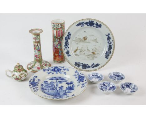 A set of four small blue and white dishes, each one decorated with mythological animals, 7cm diameter, and all with underglaz