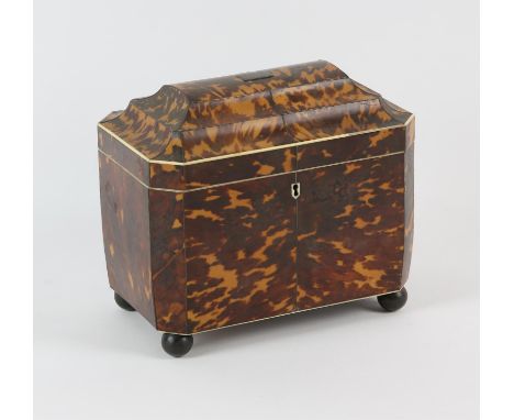 A tortoiseshell pewter and ivory tea caddy, 19th Century, the interior with a glass mixing bowl and a covered compartment wit