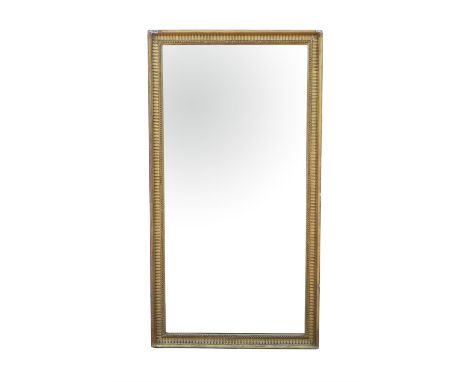 Rectangular giltwood and gesso mirror, late 19th /20th Century, moulded with beaded and fluted decoration, with bevelled plat