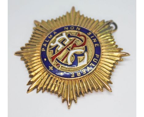 A hallmarked 9ct gold and enamel Buffaloism medallion, gross wt. 29.23g.  