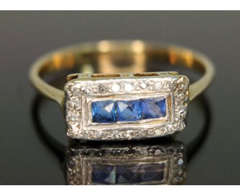 An early 20th century diamond and sapphire cluster ring, the rectangular cluster measuring 12.95mm x 6.88mm, band unmarked, g