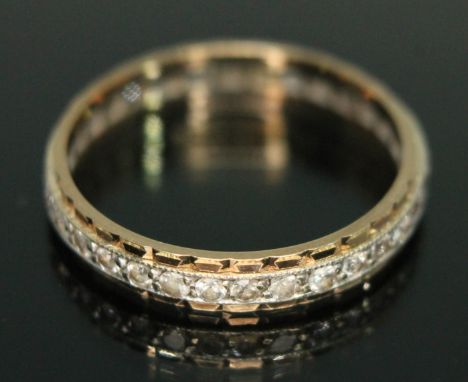 An eternity ring set with colourless stones, marked '9ct', gross wt. 2.11g, size P/Q.  