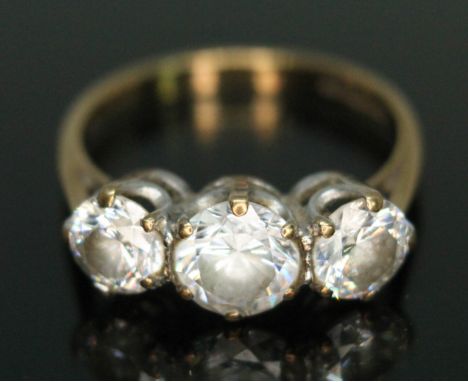 A hallmarked 9ct gold three stone cubic zirconia ring, gross wt. 2.86g, size M.  