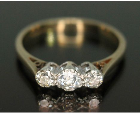 A three stone diamond ring, three Old European cut diamonds weighing approx. 0.30 carats in total, hallmarked 9ct gold band, 