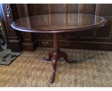 A late Georgian mahogany snap-top tripod breakfast or supper table