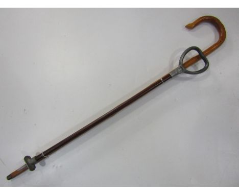 A vintage shooting stick and a shepherds crook