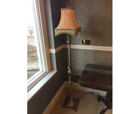 A contemporary gilt metal standard lamp