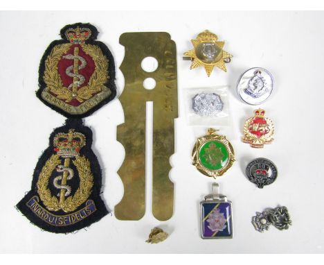 Sundry military badges etc., including two bullion examples, a white metal Border Regiment fob medallion and a brass button s