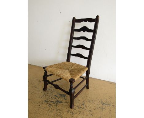A rush seated ladder back chair (a/f)