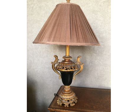 A black-glazed and gilt table lamp