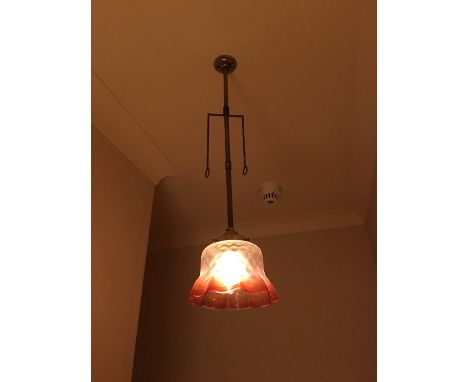 A pendant gas-type ceiling light with achromatising glass shade 