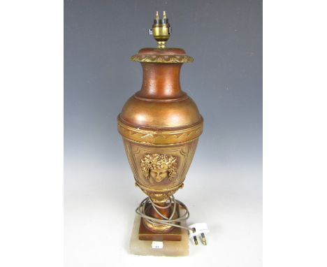 A contemporary gilt lamp base and shade