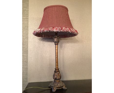 A gilt table lamp