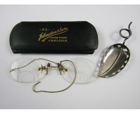 Pince nez glasses together with a caddy spoon