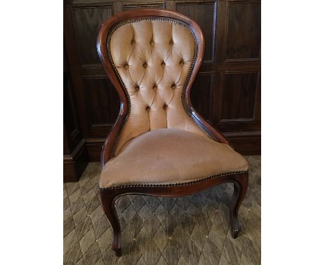 A reproduction Victorian deep-button-upholstered nursing chair