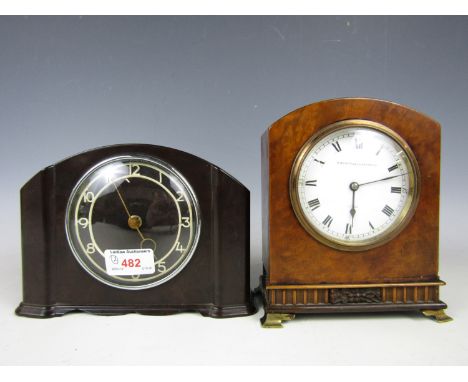 A bakelite mantel clock together with one other