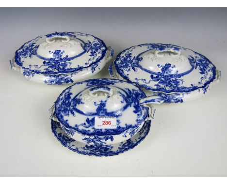 A blue and white soup tureen with stand and ladle together with two other lidded tureens