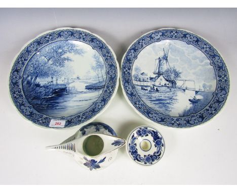 Two Delft plates, a candlestick and a jug