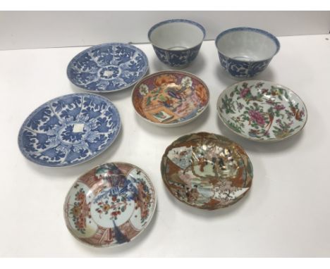 A pair of Chinese Kangxi "Vung Tau Cargo" bowls and saucers with panels of hatched foliage and flowers, bearing patched ribbo