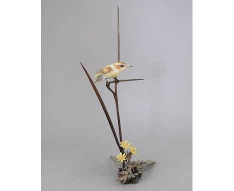 An Albany Fine China Co. ceramic bird study incorporating metal. Modelled as a Warbler. Factory mark to metal base. 29 cm tal