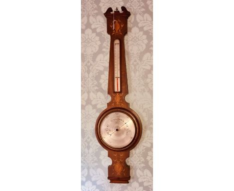 An Edwardian mahogany and strung and parquetry inlaid aneroid wheel barometer, circa 1910, swan neck pediment with metal urn 