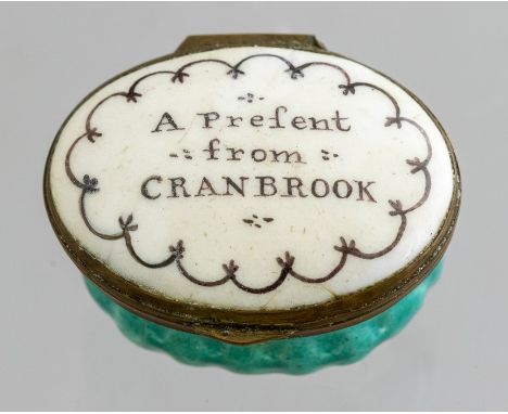 A Bilston oval enamel patch box, circa 1780, motto to cover A Present from Cranbrook, width 4cm