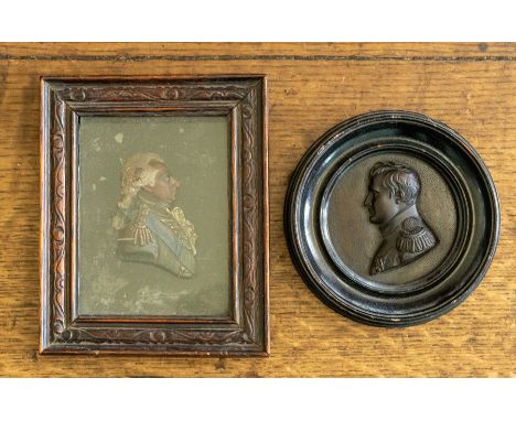 A 19th Century cast bronze profile portrait plaque of Napoleon, diameter 7cm,together with a profile portrait of Admiral St V