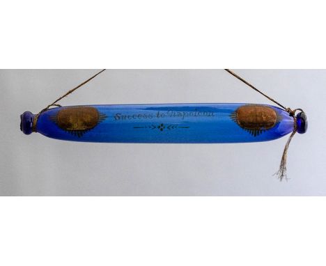 An early 19th Century Bristol blue glass rolling pin of Napoleonic interest, gilt motto  - Success to Napoleon, flanked by tw